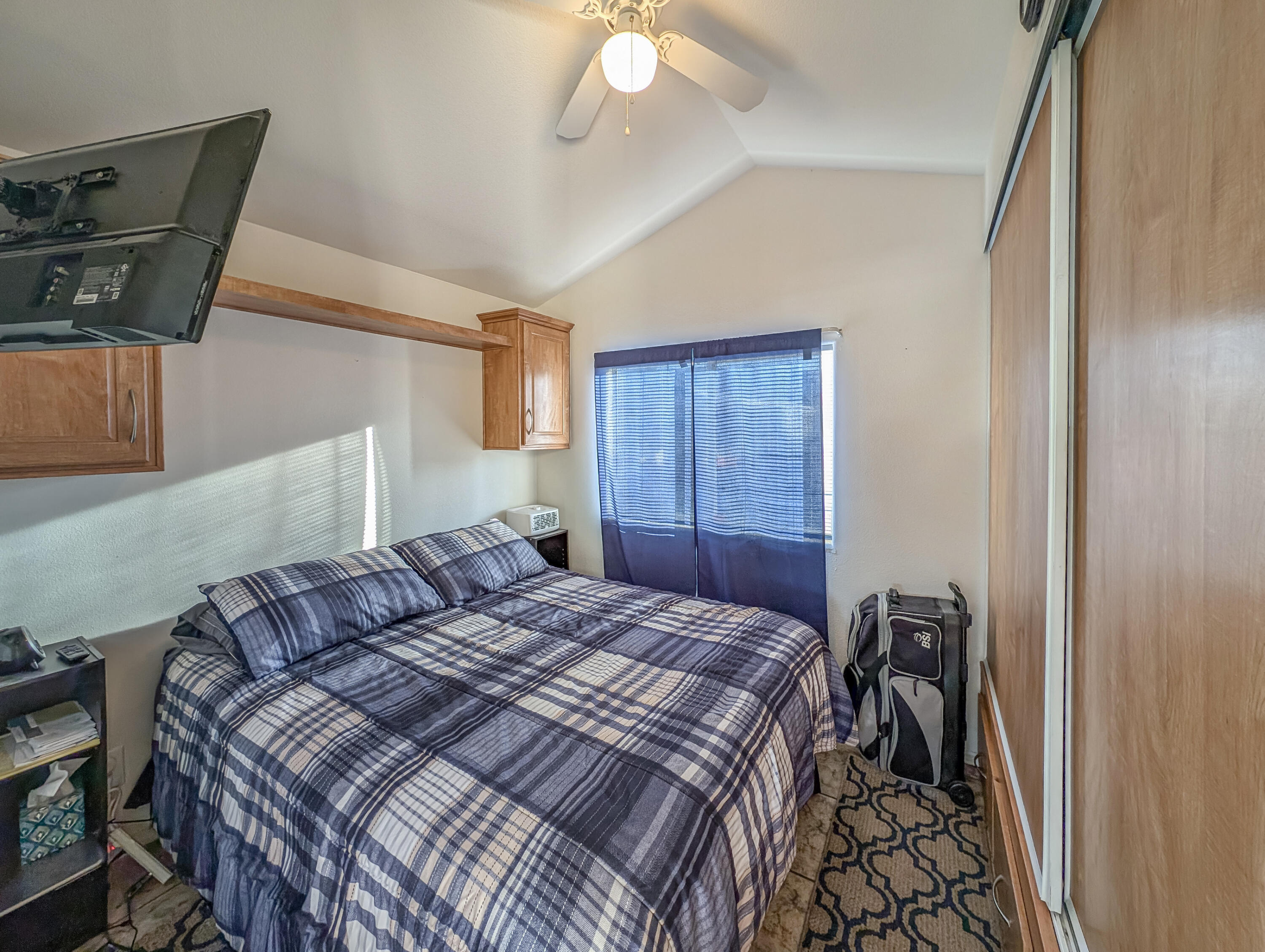 70200 Dillon Road, Unit 350 Desert Hot Springs, CA 92241 - Photo 15 of 22 a bedroom with a bed and window