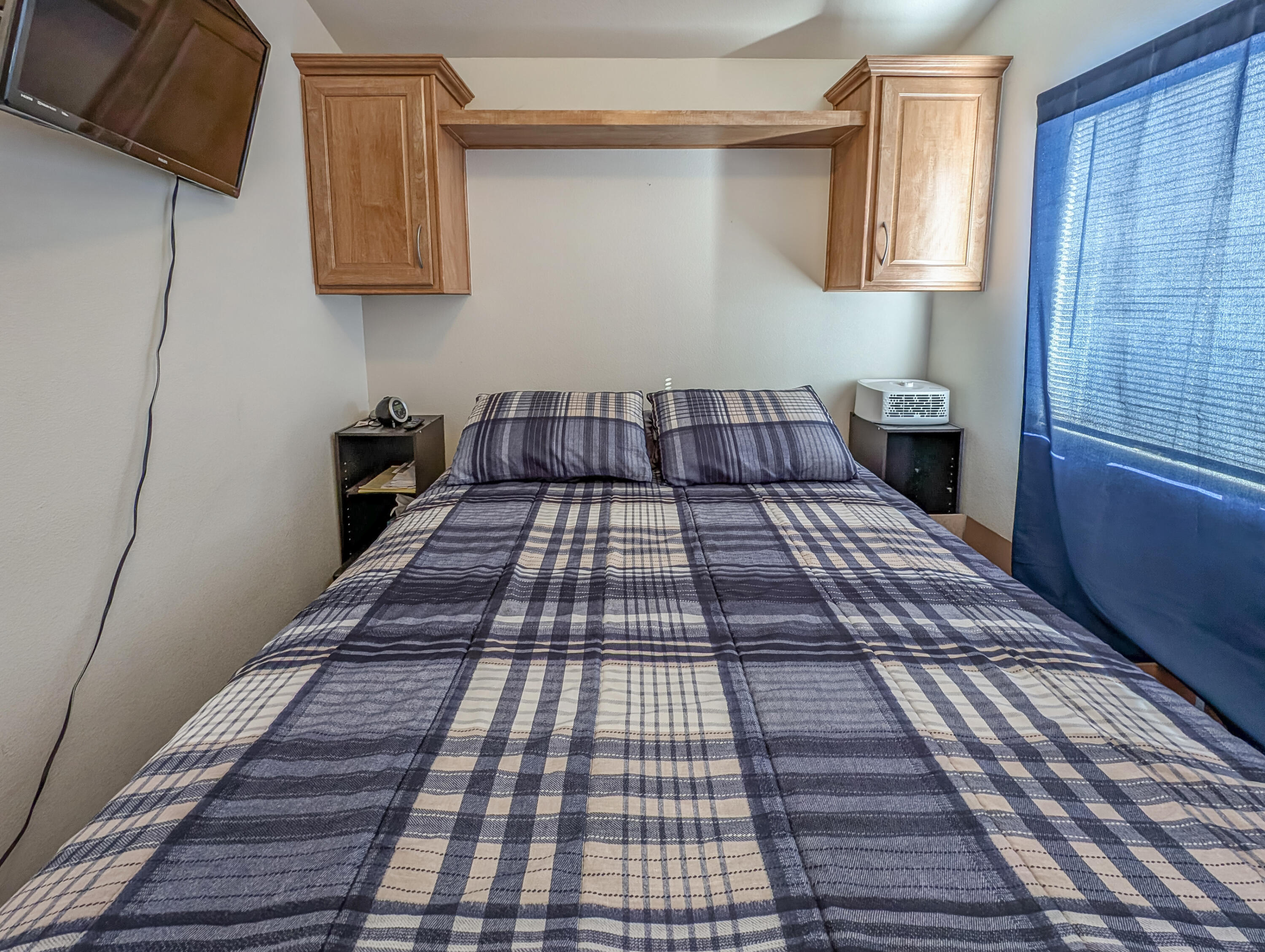 70200 Dillon Road, Unit 350 Desert Hot Springs, CA 92241 - Photo 16 of 22 a kitchen with a black white checkered floor