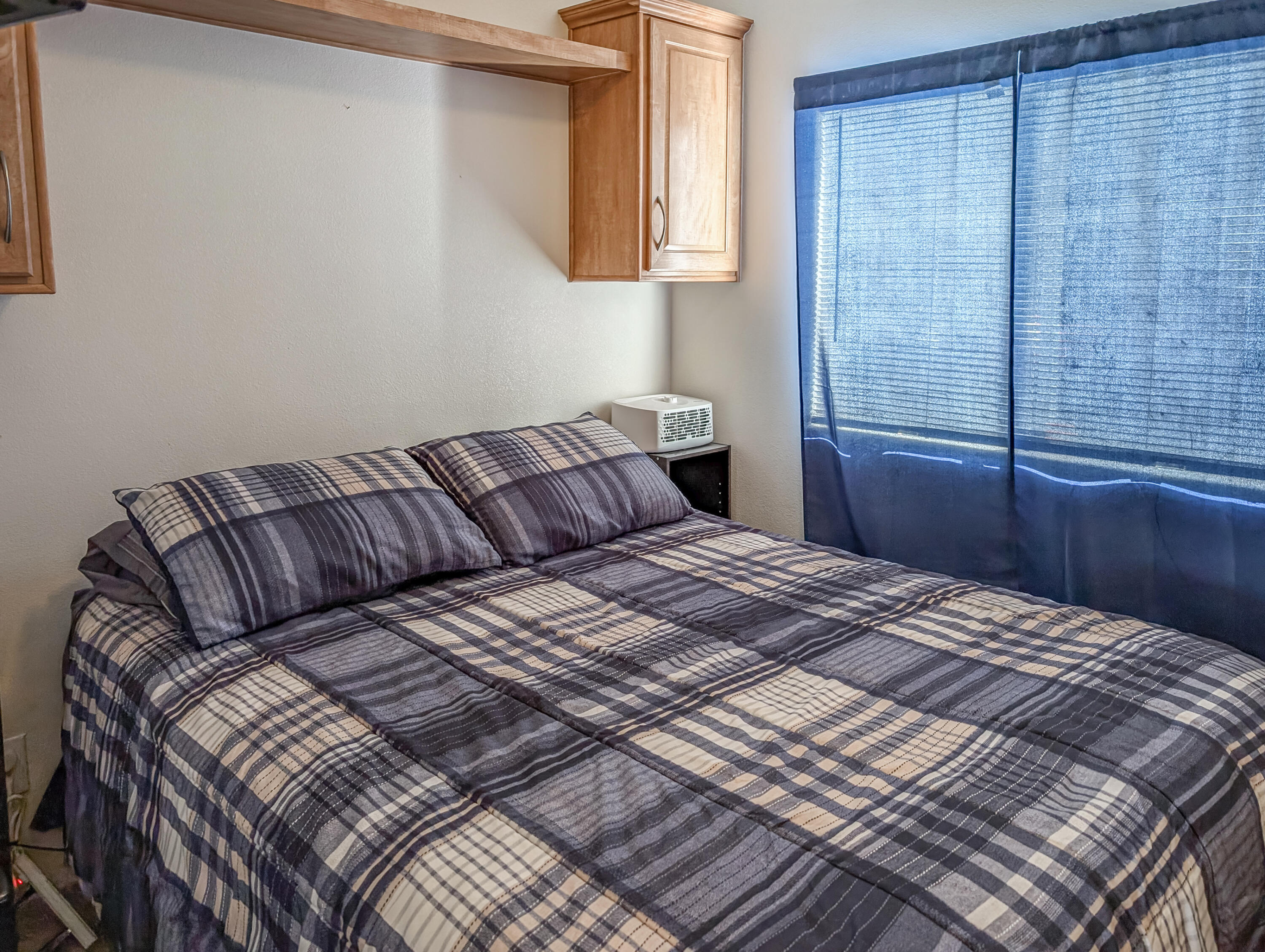 70200 Dillon Road, Unit 350 Desert Hot Springs, CA 92241 - Photo 17 of 22 a bedroom with a bed and wooden floor