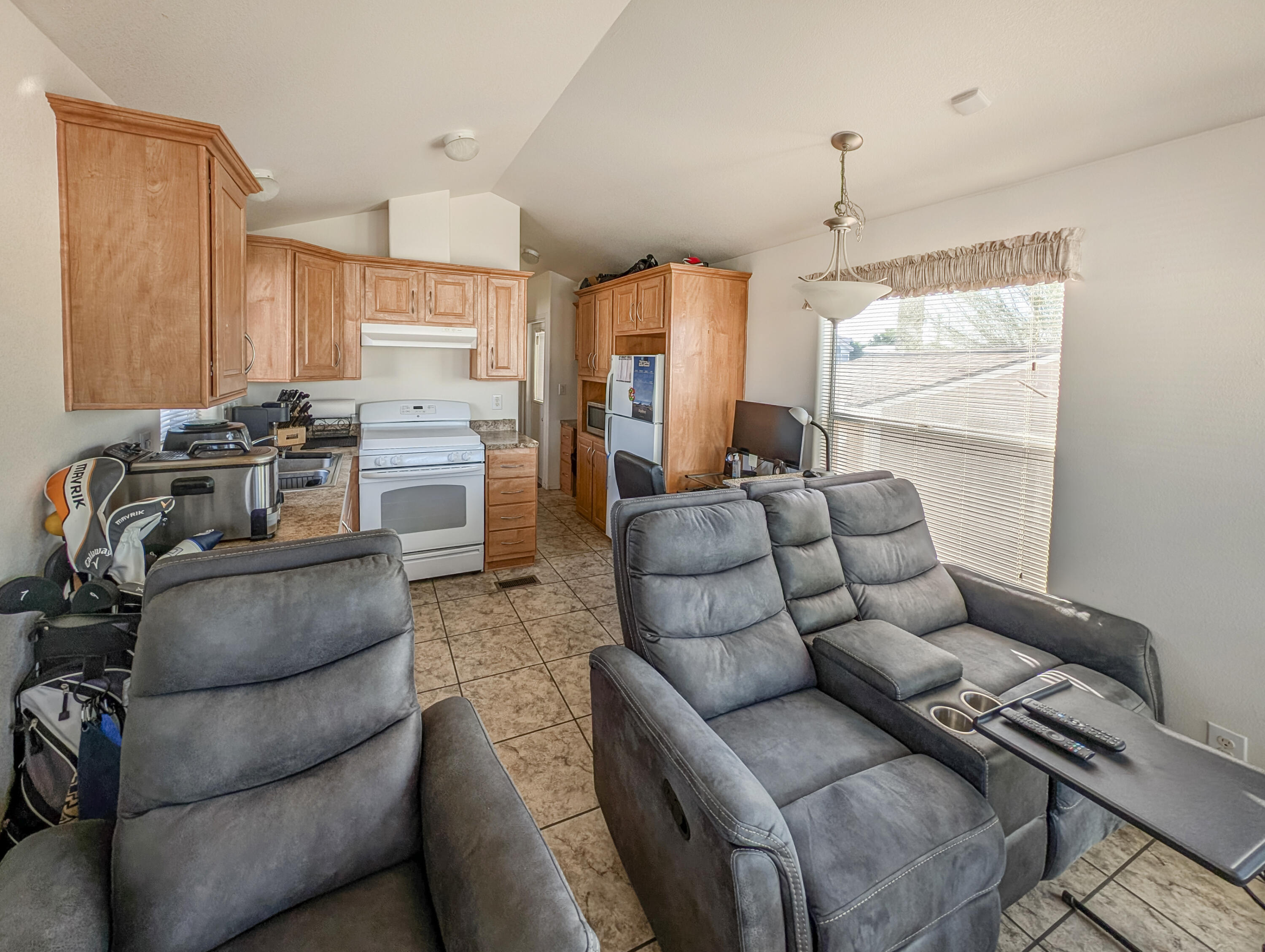 70200 Dillon Road, Unit 350 Desert Hot Springs, CA 92241 - Photo 7 of 22 a living room with furniture and a chandelier