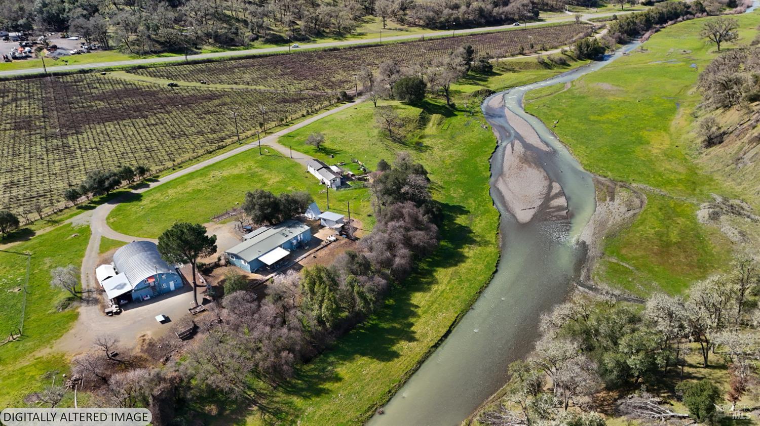6750 State Highway 20 Ukiah, CA 95482 - Photo 11 of 37 an aerial view of a house with a yard and lake view