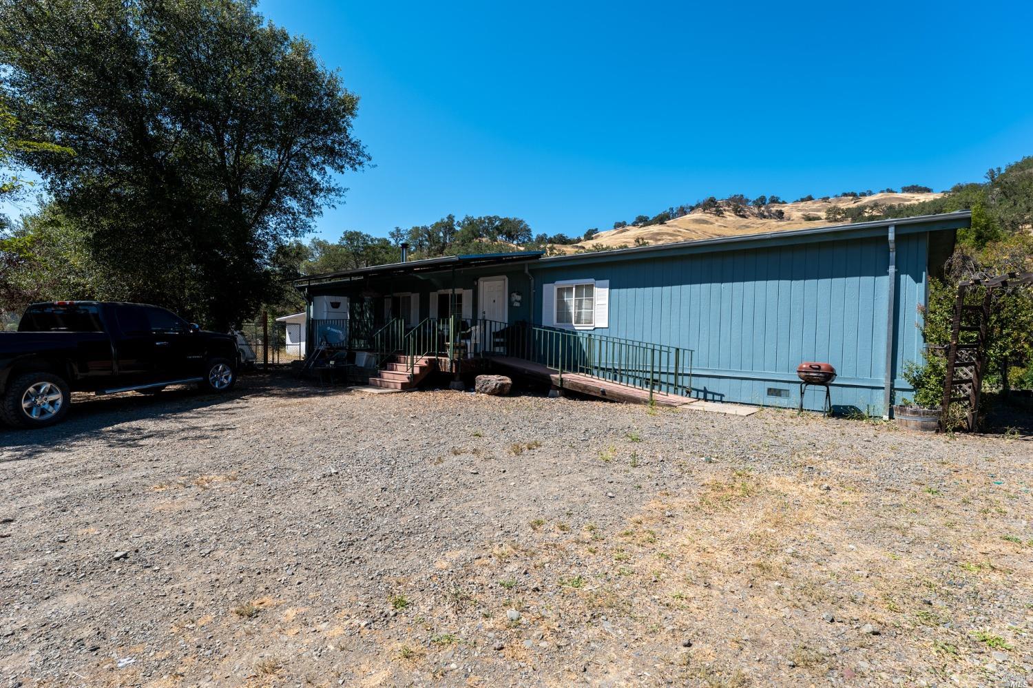6750 State Highway 20 Ukiah, CA 95482 - Photo 16 of 37 a view of a house with a yard covered in snow