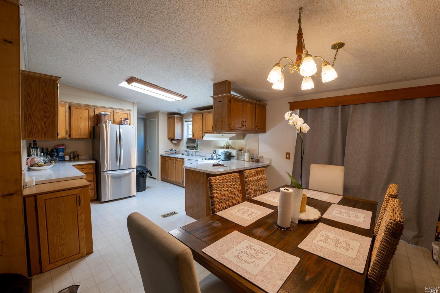 6750 State Highway 20 Ukiah, CA 95482 - Photo 18 of 37 a large kitchen with a table and chairs