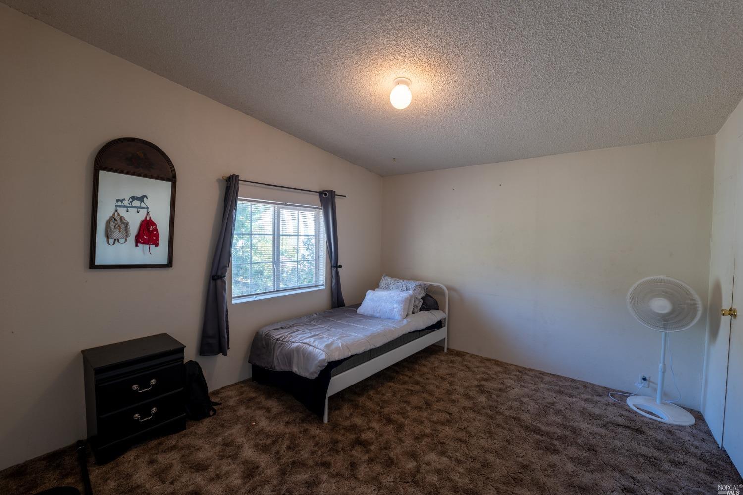6750 State Highway 20 Ukiah, CA 95482 - Photo 24 of 37 a room with furniture and window