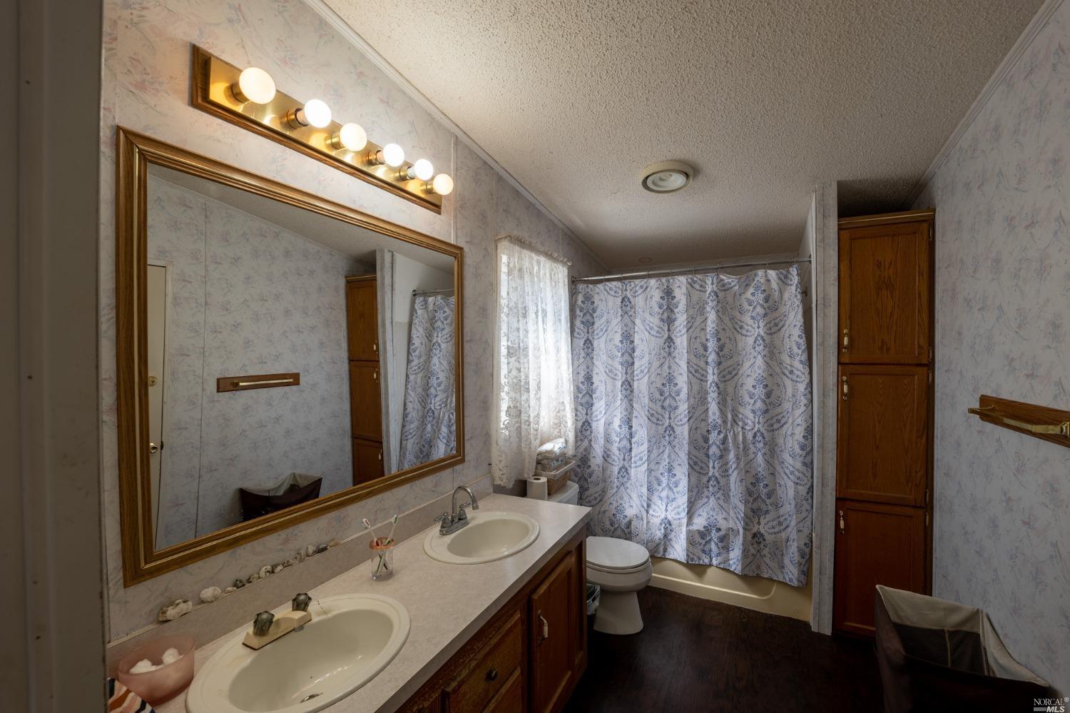 6750 State Highway 20 Ukiah, CA 95482 - Photo 29 of 37 a bathroom with a sink and a mirror