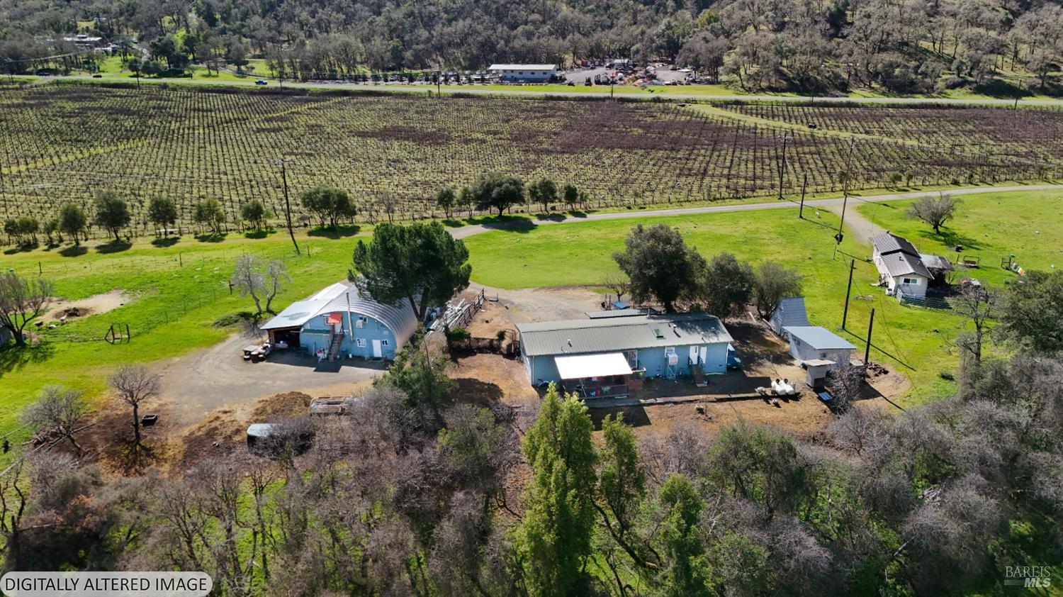 6750 State Highway 20 Ukiah, CA 95482 - Photo 3 of 37 an aerial view of a house with a lake view and a yard