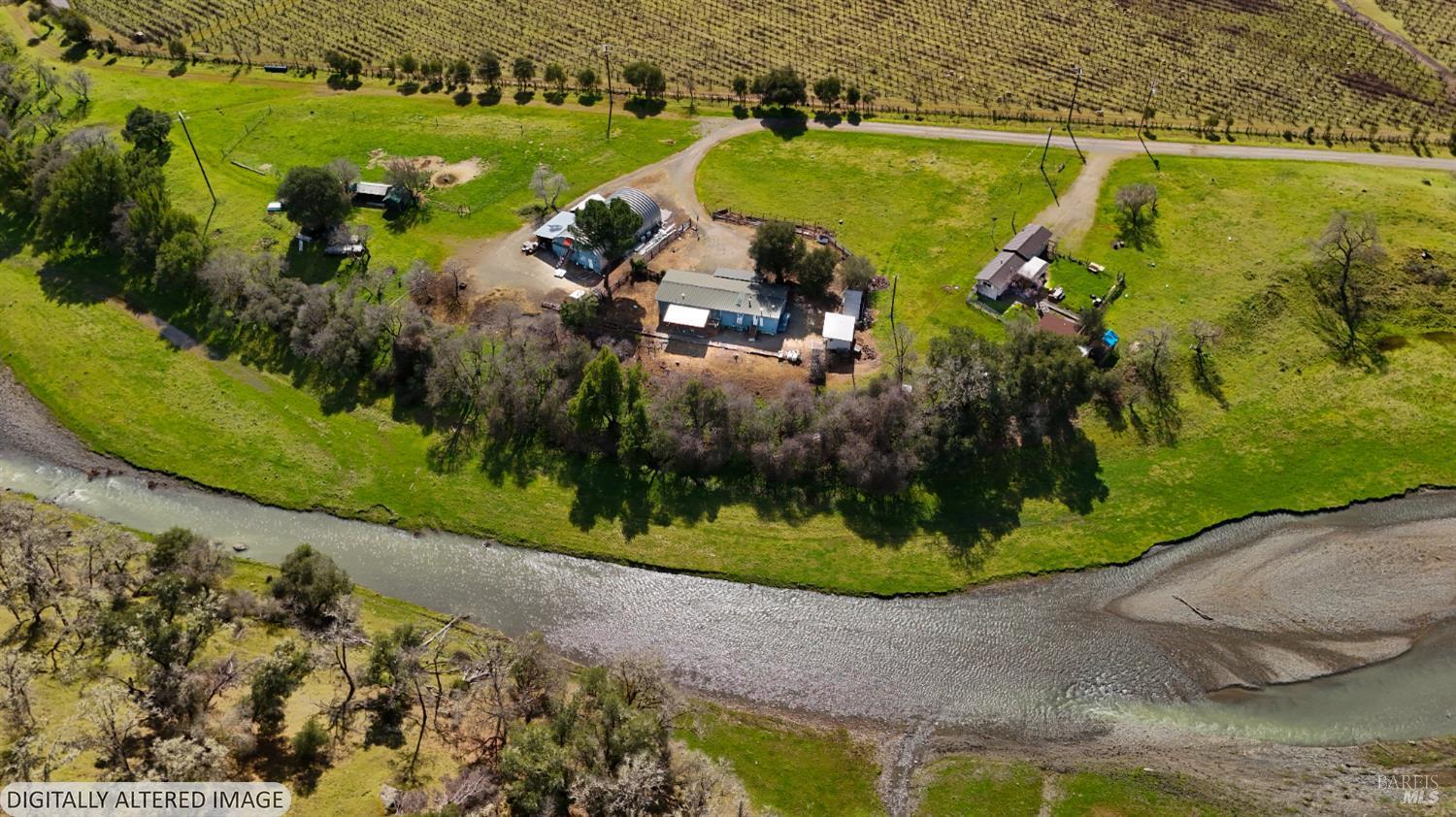 6750 State Highway 20 Ukiah, CA 95482 - Photo 4 of 37 an aerial view of a house with a yard and lake view