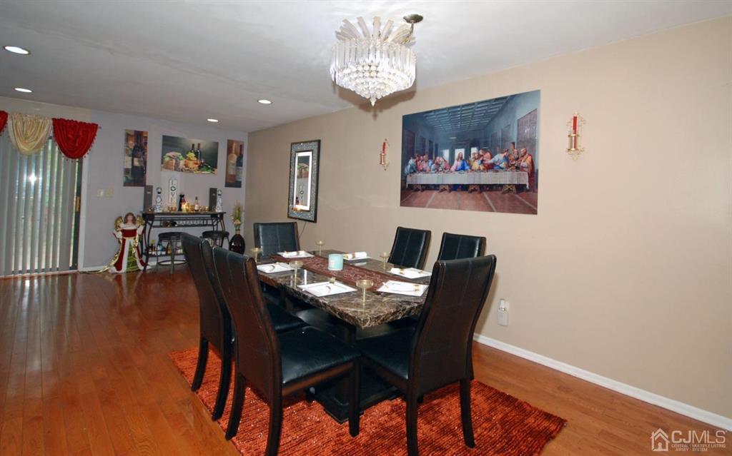 2 Tulip Court Edison, NJ 08820 - Photo 11 of 34 a view of a dining room with furniture wooden floor and chandelier