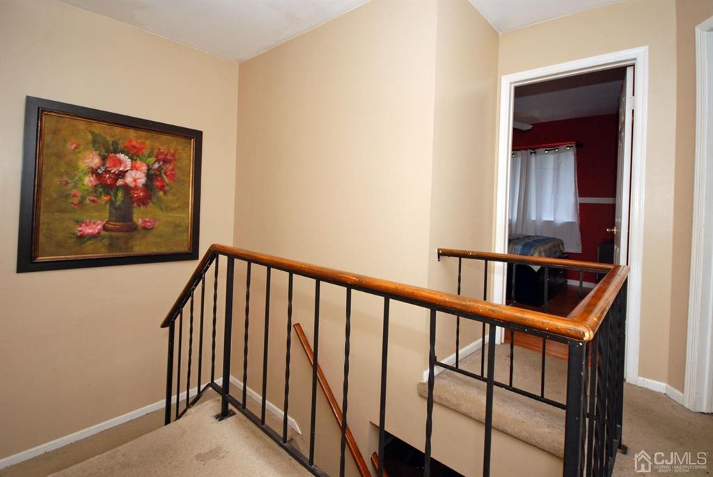 2 Tulip Court Edison, NJ 08820 - Photo 15 of 34 a view of staircase with wooden floor