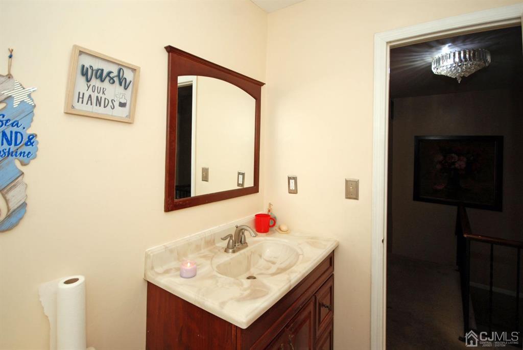 2 Tulip Court Edison, NJ 08820 - Photo 24 of 34 a bathroom with a sink vanity and a mirror