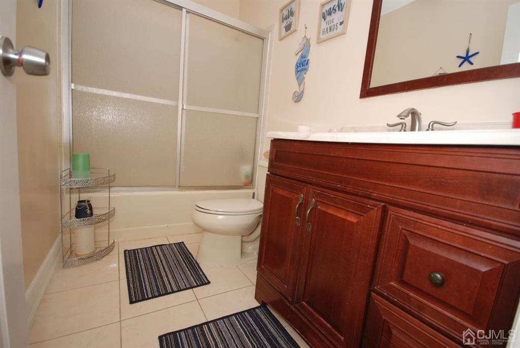 2 Tulip Court Edison, NJ 08820 - Photo 25 of 34 a bathroom with a sink and a toilet