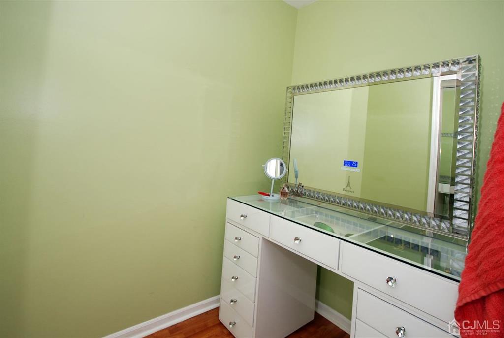 2 Tulip Court Edison, NJ 08820 - Photo 26 of 34 a bathroom with a granite countertop sink and a mirror