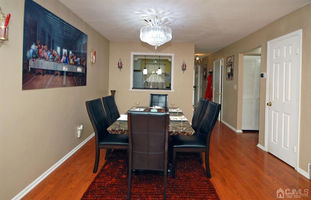 2 Tulip Court Edison, NJ 08820 - Photo 5 of 34 a view of a dining room with furniture window and wooden floor