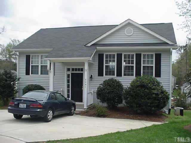 3201 Stedman Drive Raleigh, NC 27607 - Photo 1 of 7 a car parked in front of a white house