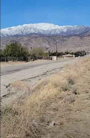 a view of a town with mountains in the background