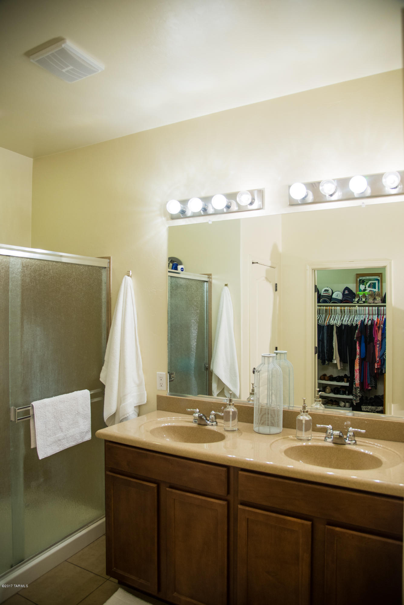 4405 West Crystal Ranch Place Marana, AZ 85658 - Photo 26 of 44 a bathroom with a double vanity sink and a mirror