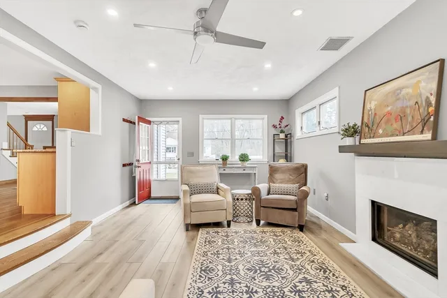 a living room with furniture and a fireplace