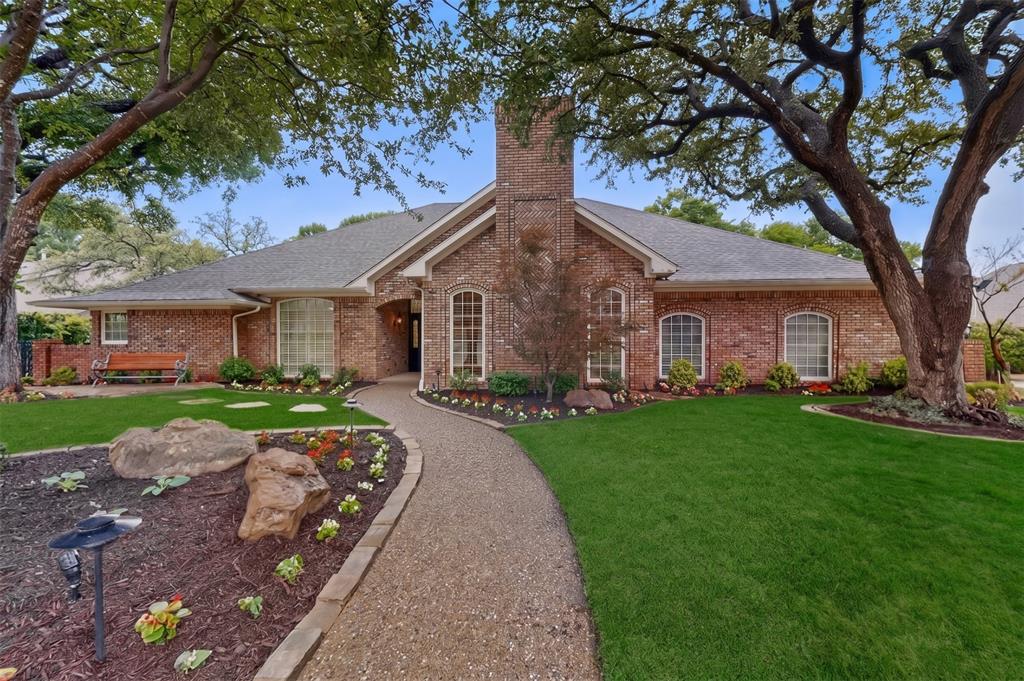 2405 Wing Point Lane Plano, TX 75093 - Photo 1 of 39 a front view of a house with yard patio and green space