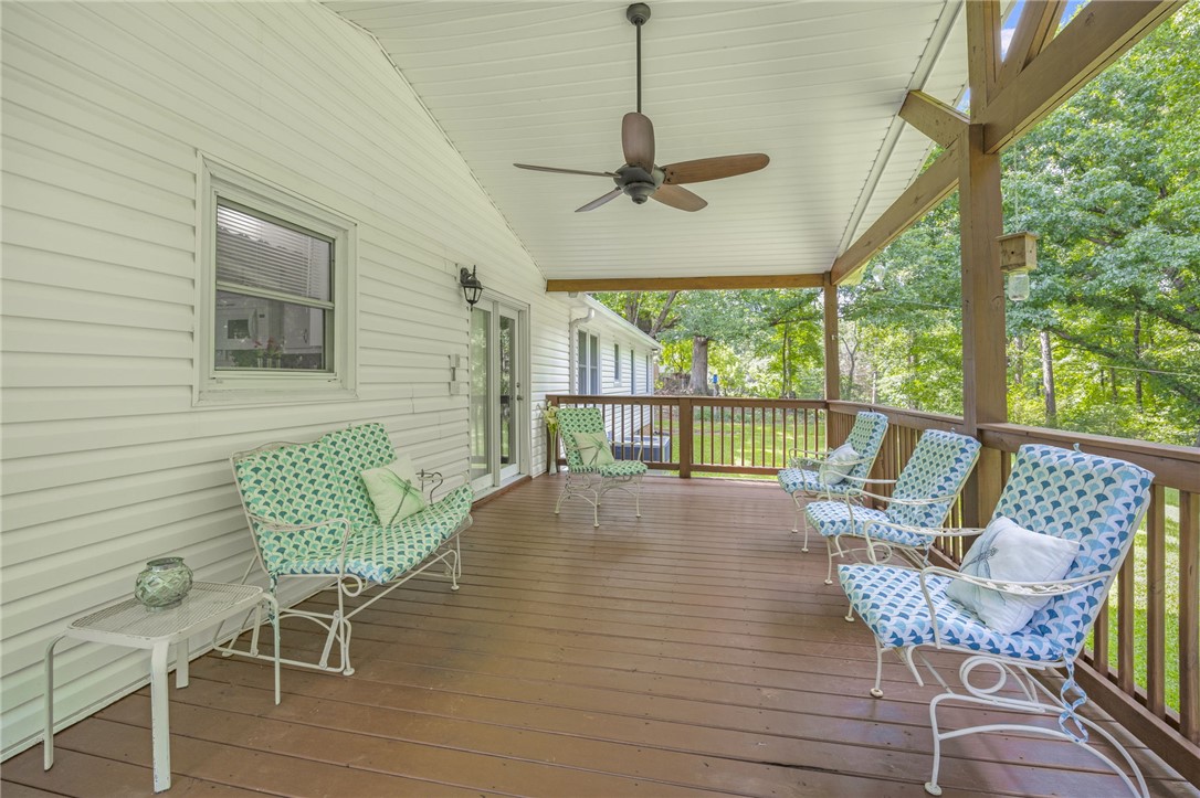 250 Rockcrest Road Cleveland, SC 29635 - Photo 29 of 37 A spacious covered porch with a ceiling fan offers a serene outdoor retreat.