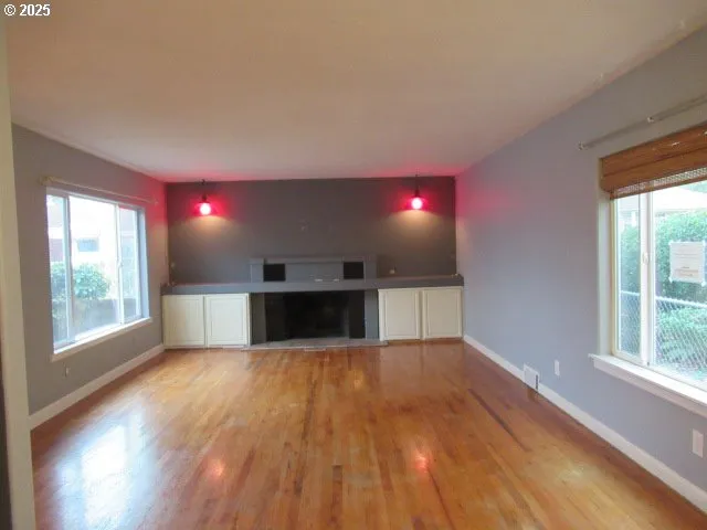 a view of a kitchen with a sink and a window