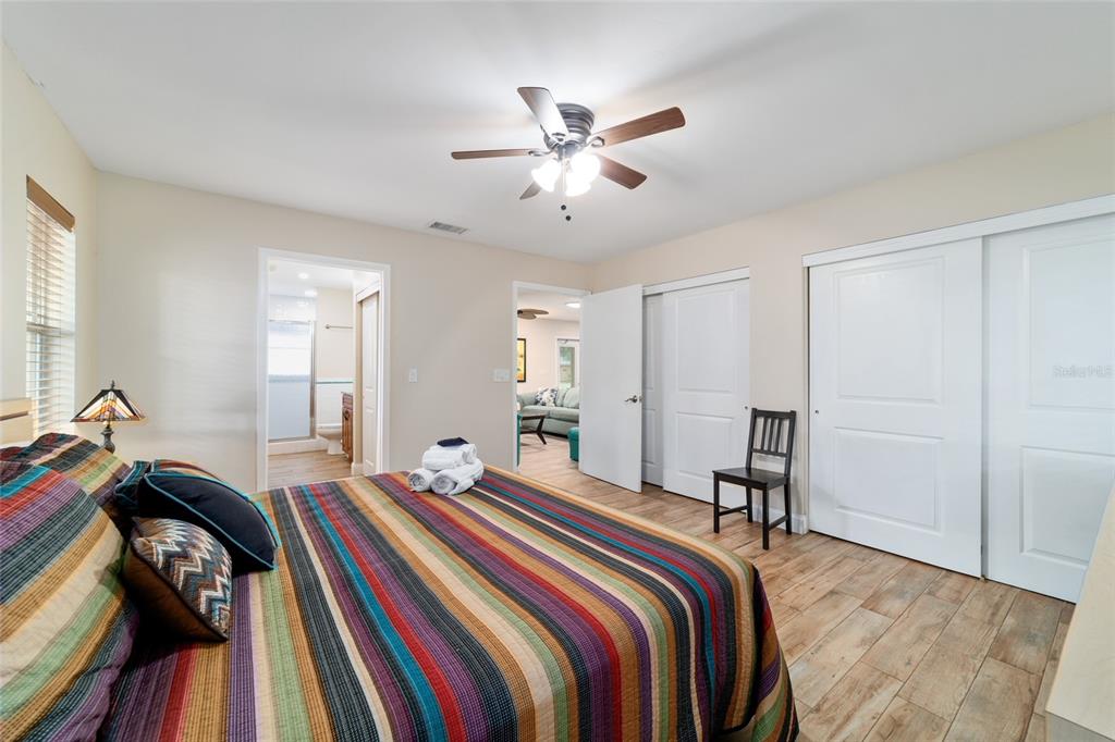 16520 Northwest 170th Street Williston, FL 32696 - Photo 26 of 98 a bedroom with a bed and a chandelier