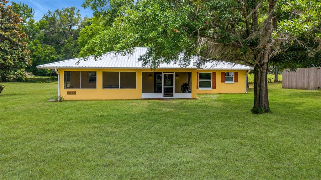 16520 Northwest 170th Street Williston, FL 32696 - Photo 37 of 98 a front view of house with a garden and trees
