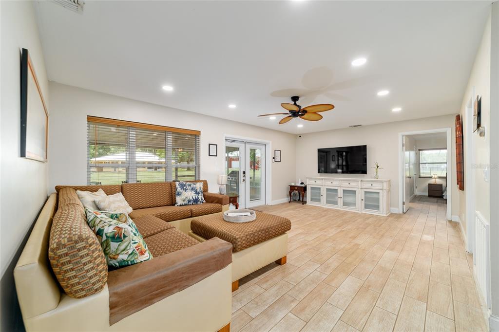 16520 Northwest 170th Street Williston, FL 32696 - Photo 45 of 98 a living room with furniture and a flat screen tv