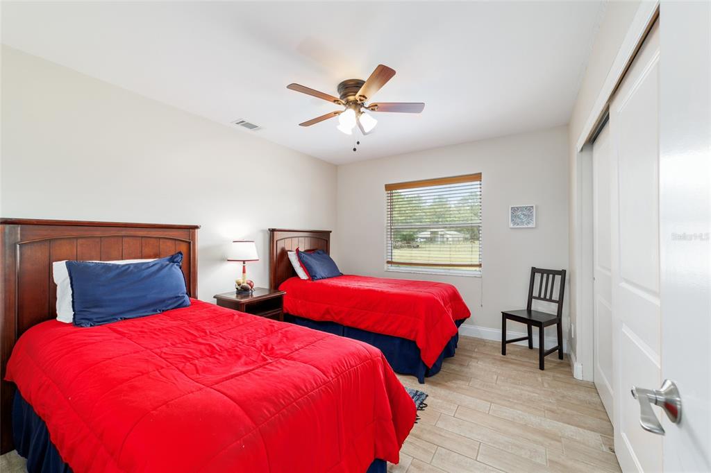 16520 Northwest 170th Street Williston, FL 32696 - Photo 59 of 98 a bedroom with two beds and a window