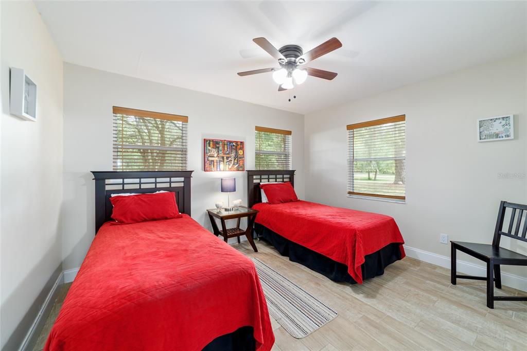 16520 Northwest 170th Street Williston, FL 32696 - Photo 62 of 98 a bedroom with two beds and a window