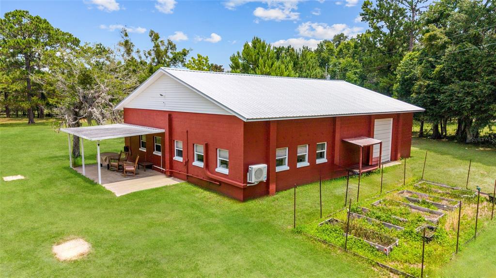 16520 Northwest 170th Street Williston, FL 32696 - Photo 79 of 98 a view of a house with backyard porch and sitting area