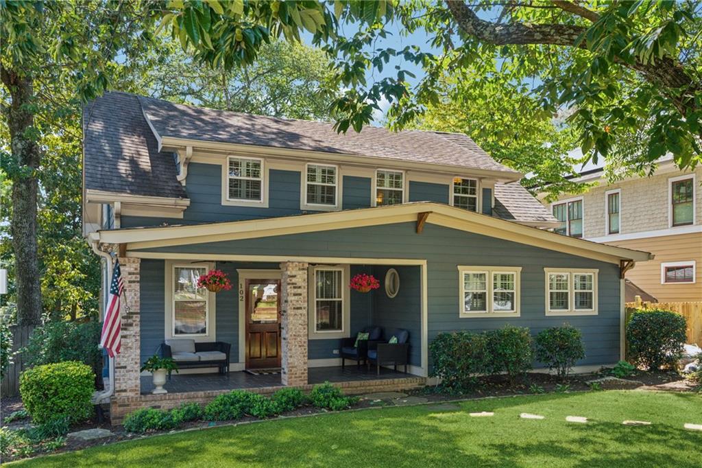 front view of a house with a yard
