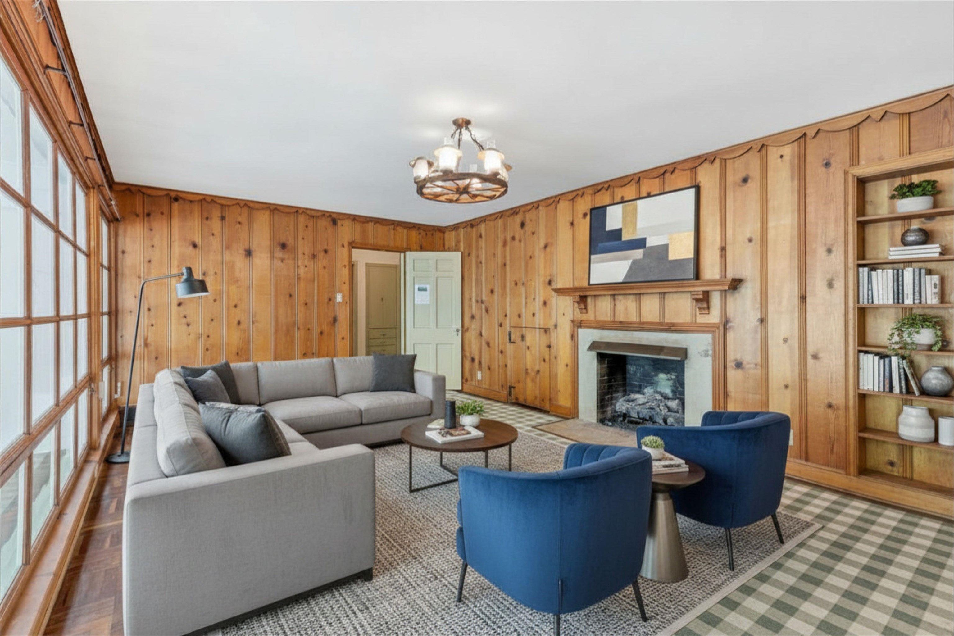 3758 Walnut Grove Road Memphis, TN 38111 - Photo 12 of 34 DEN w/GAS LOG FIREPLACE (22x13) - Cozy Den with rich wood paneling, fireplace with mantel, and built-in shelving. Large windows provide natural light. Virtually Staged Photo
