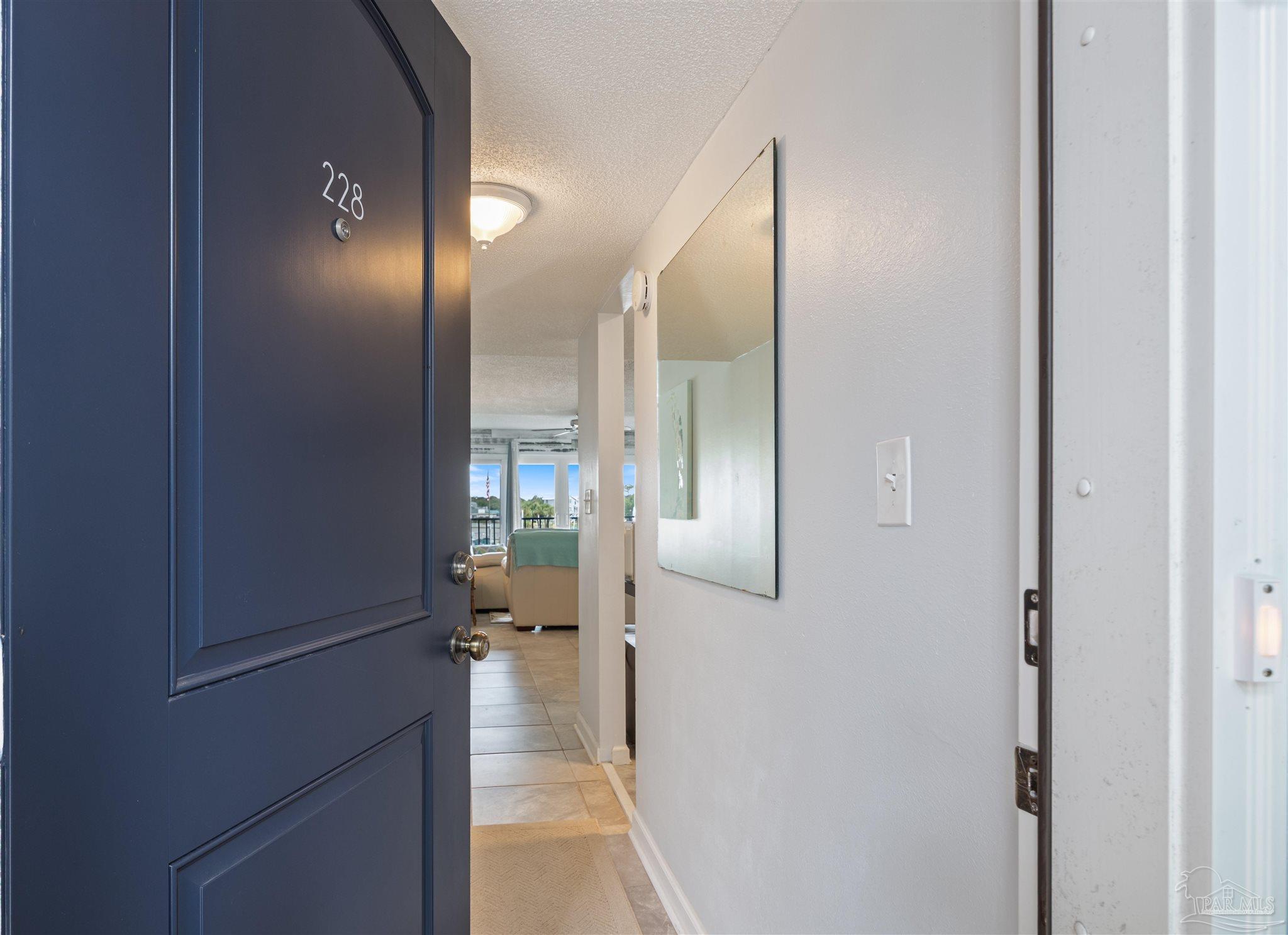 14100 River Road, Unit 228B Pensacola, FL 32507 - Photo 4 of 41 a view of a hallway with a elevator