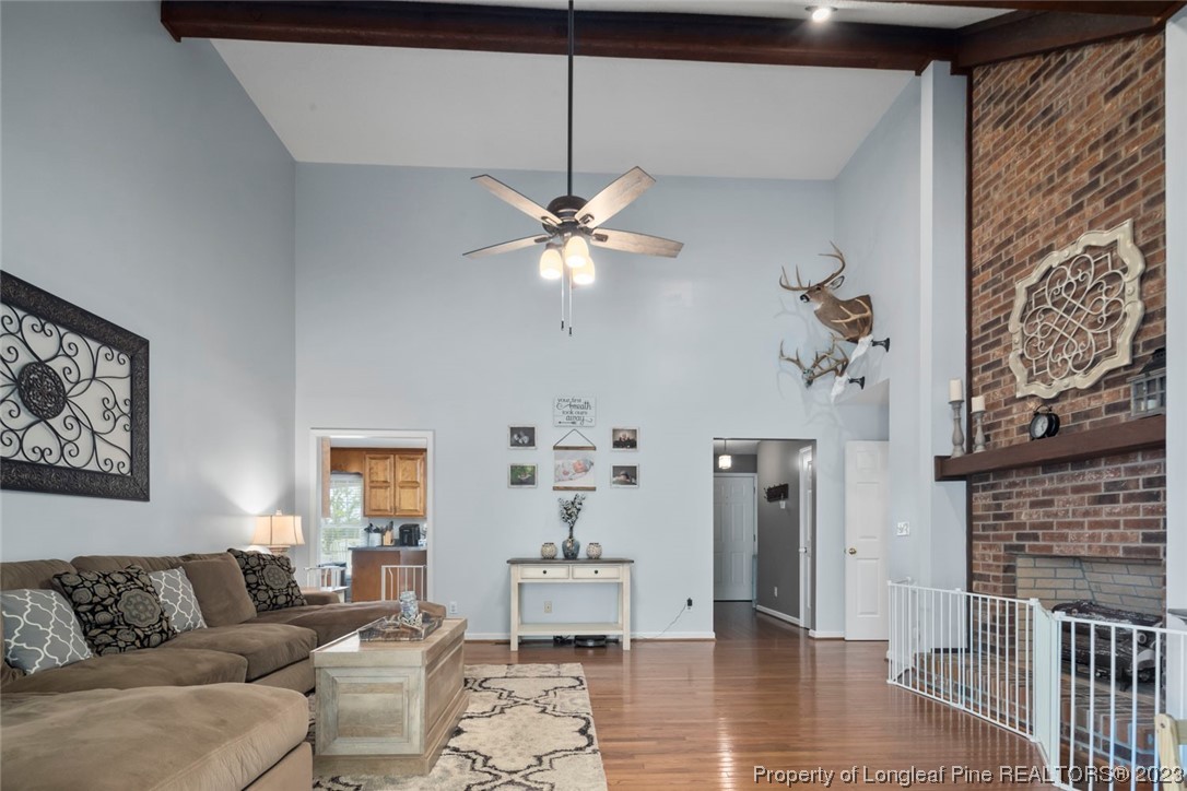 2451 Turnpike Road Raeford, NC 28376 - Photo 23 of 32 a living room with furniture and a fireplace