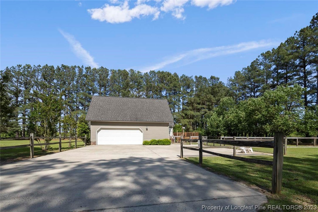 2451 Turnpike Road Raeford, NC 28376 - Photo 3 of 32 a view of house with yard and entertaining space