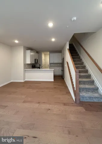 a view of a kitchen with a sink and cabinets