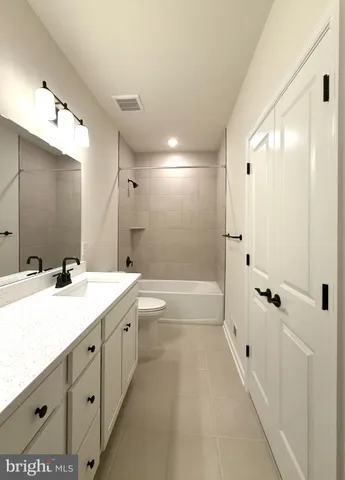 a view of a hallway with washer and dryer