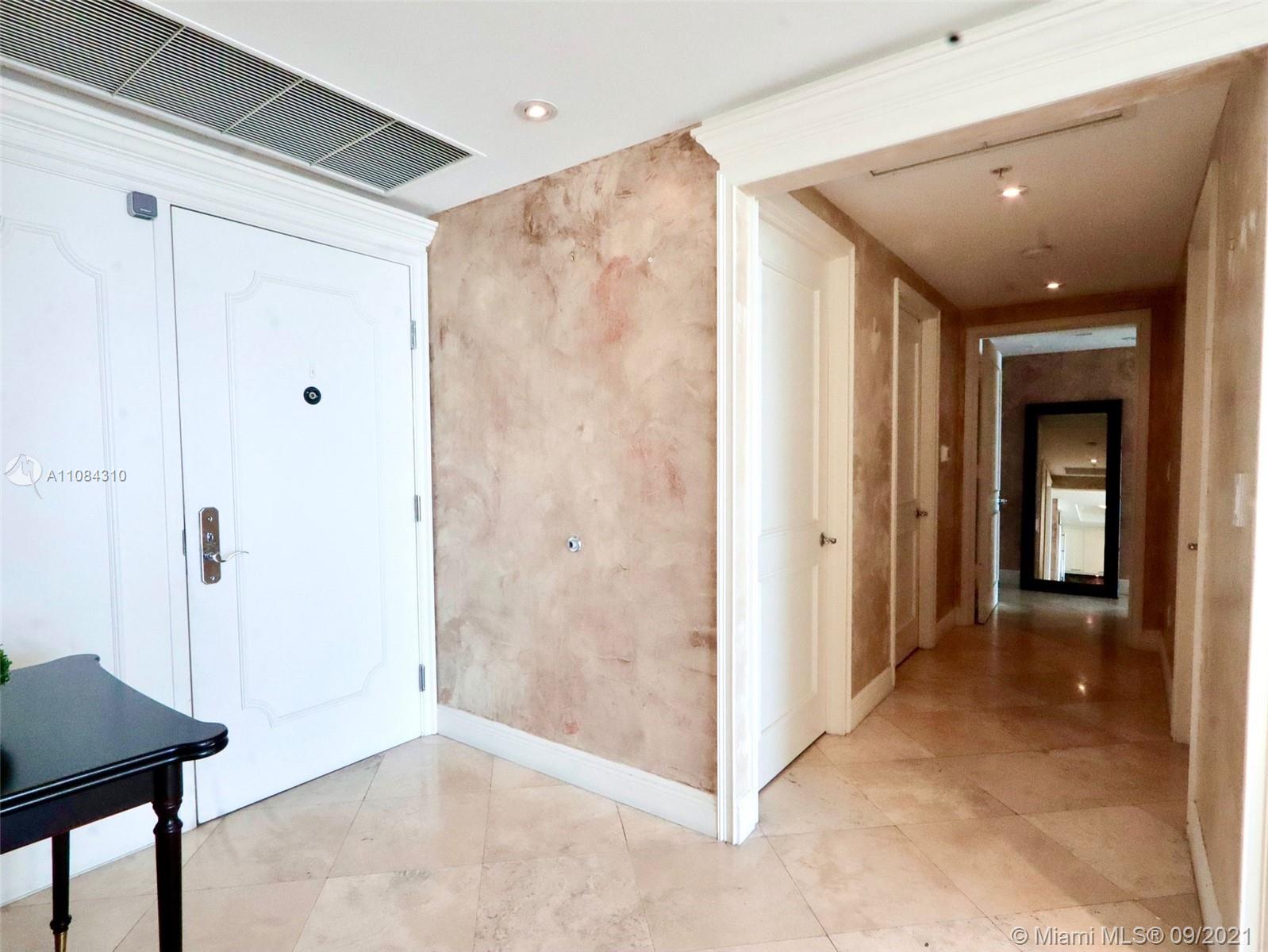 The Grove Coconut Grove, FL 33133 - Photo 29 of 31 a view of a hallway with wooden shelves