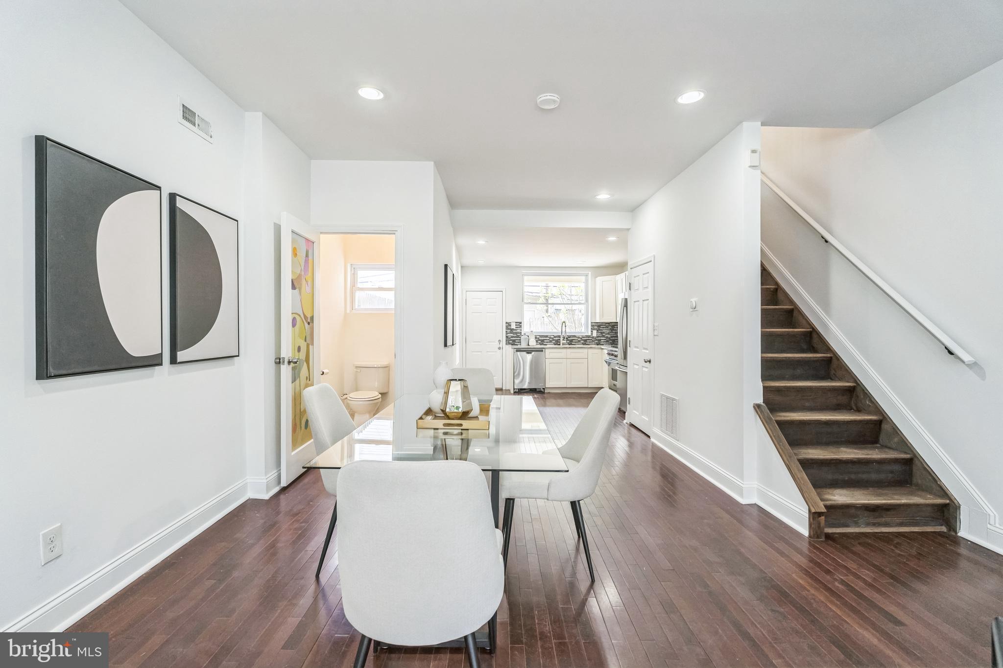 1816 Reed Street Philadelphia, PA 19146 - Photo 11 of 30 a living room with furniture and a wooden floor