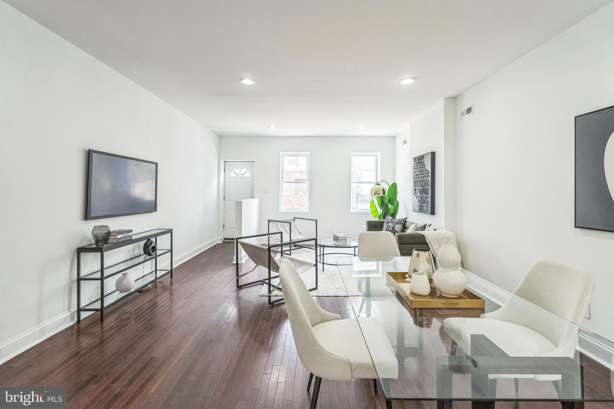 1816 Reed Street Philadelphia, PA 19146 - Photo 2 of 30 a living room with furniture and a flat screen tv