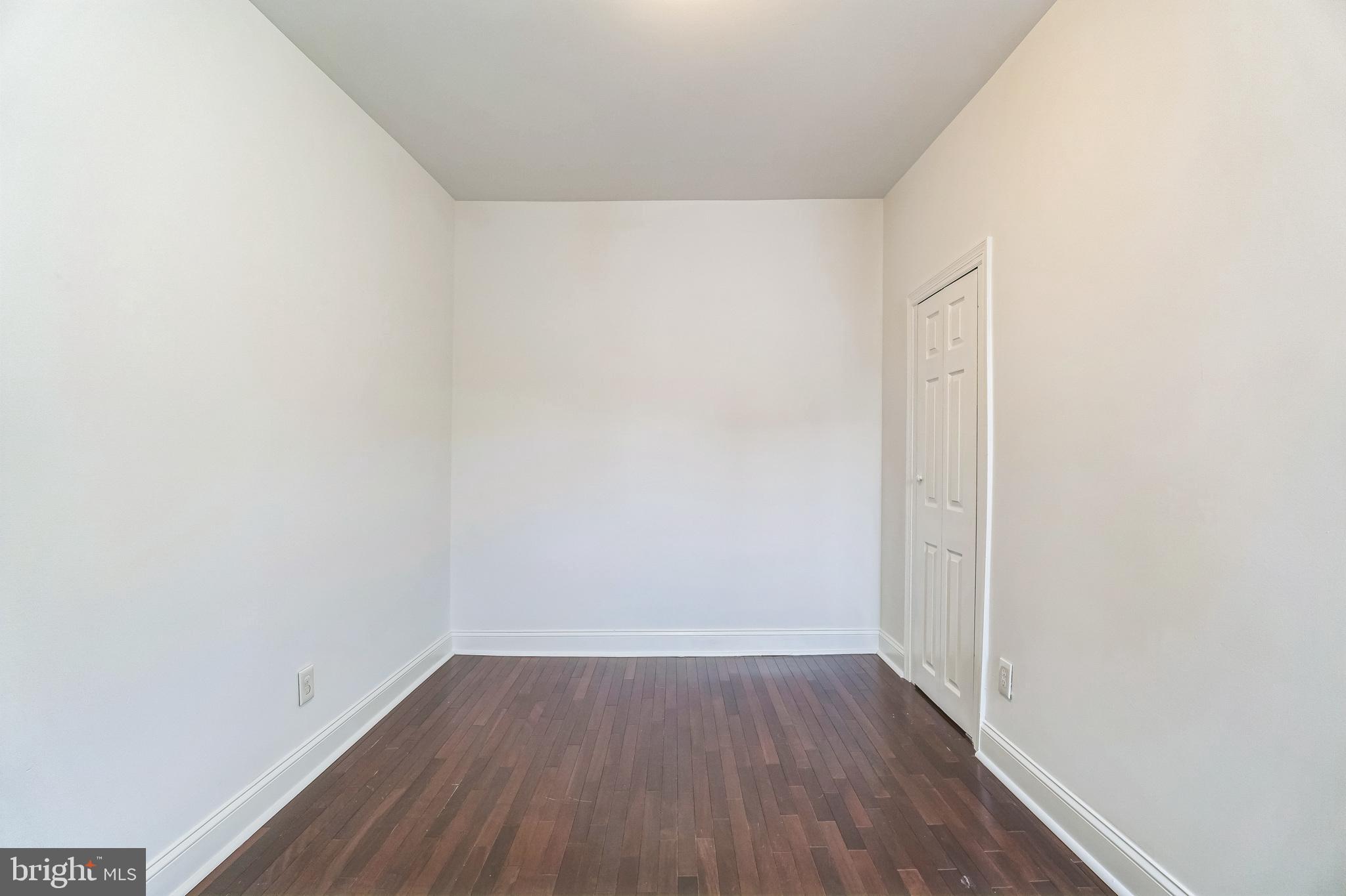 1816 Reed Street Philadelphia, PA 19146 - Photo 22 of 30 a view of a small space with wooden floor and a window
