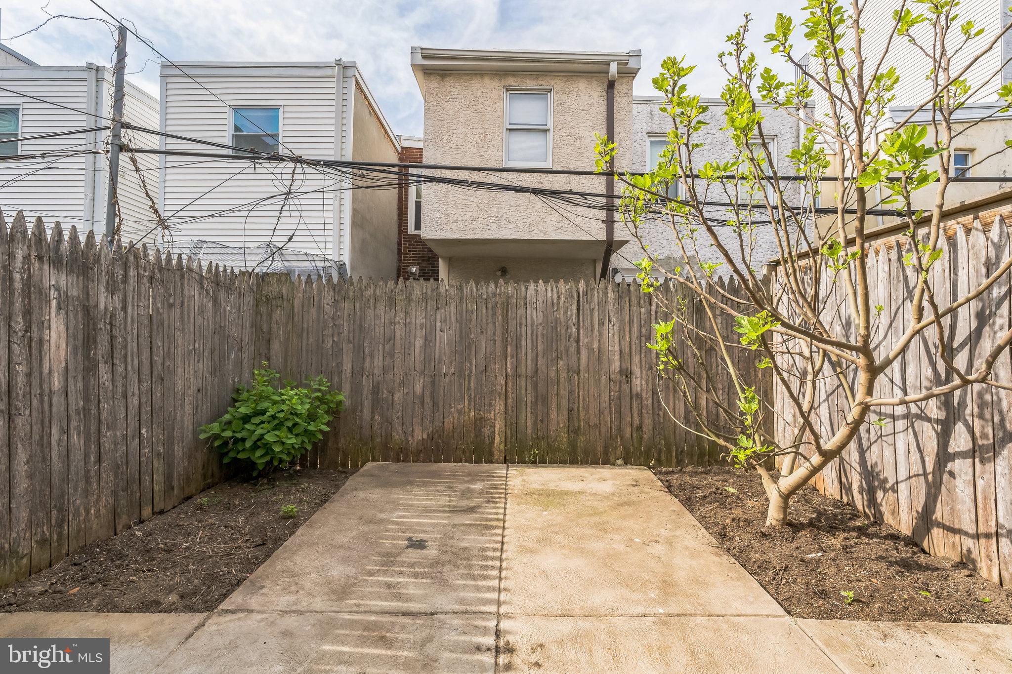 1816 Reed Street Philadelphia, PA 19146 - Photo 28 of 30 a view of a pathway of a house with a small yard