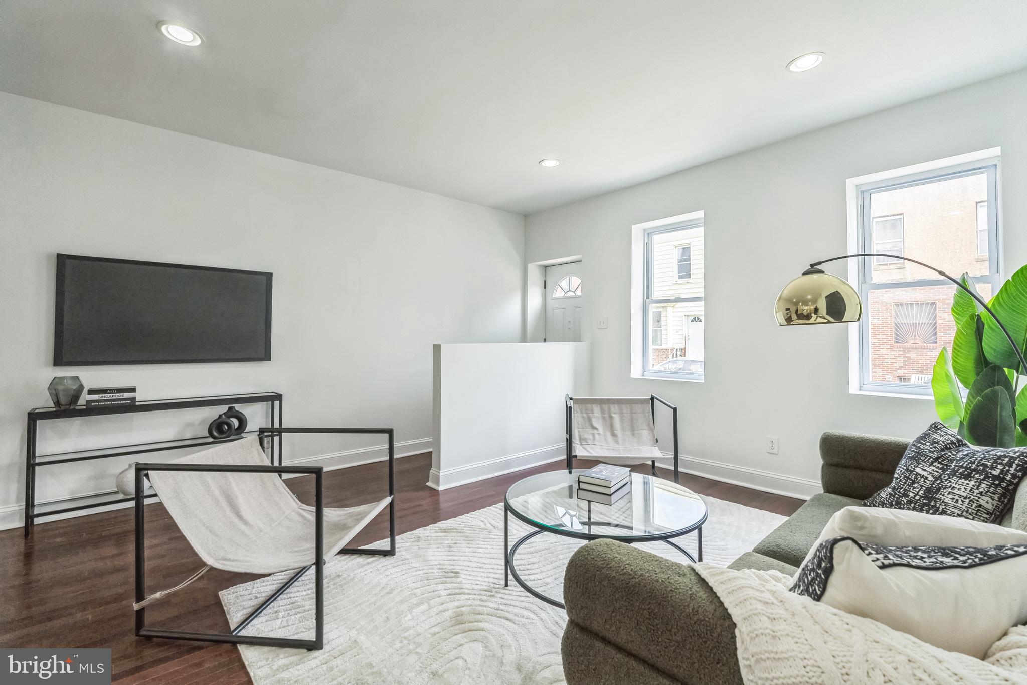 1816 Reed Street Philadelphia, PA 19146 - Photo 3 of 30 a living room with furniture and a flat screen tv