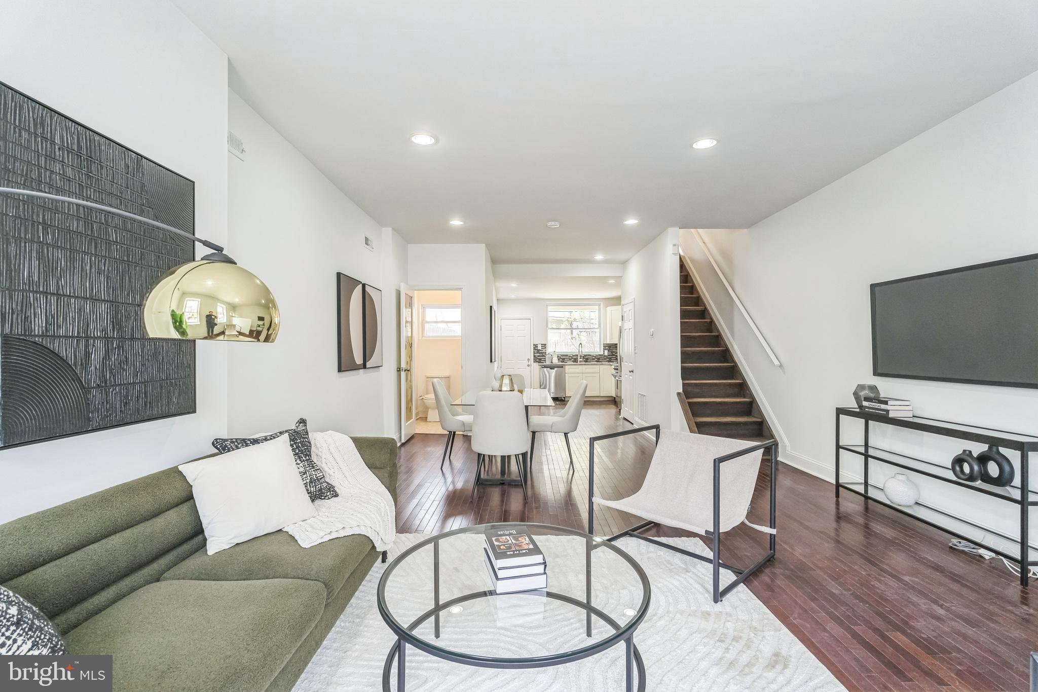 1816 Reed Street Philadelphia, PA 19146 - Photo 4 of 30 a living room with furniture and a flat screen tv