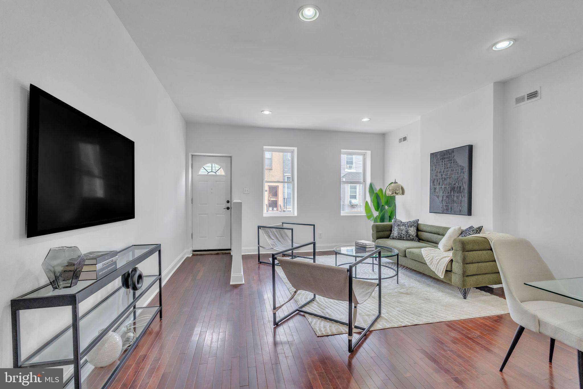 1816 Reed Street Philadelphia, PA 19146 - Photo 7 of 30 a living room with furniture and a flat screen tv
