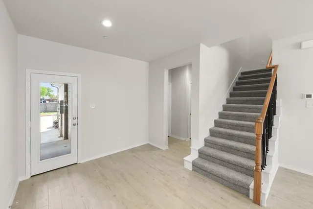 a view of entryway with wooden floor