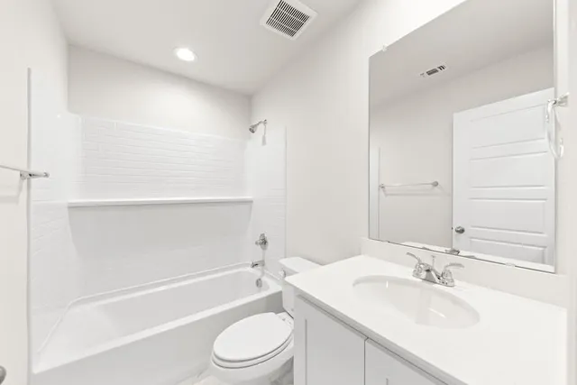 a bathroom with a sink a toilet and tub