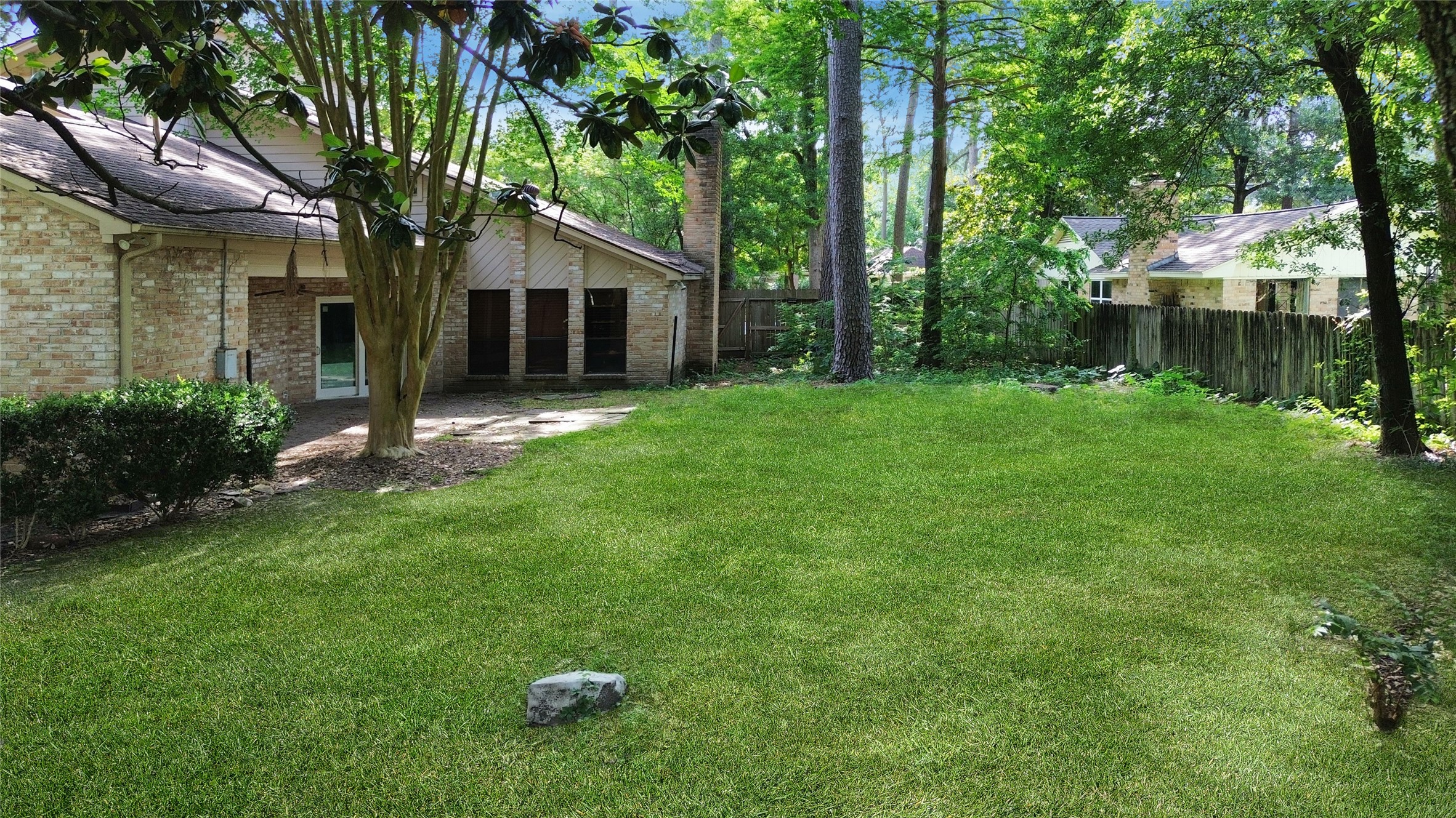6514 Misty Springs Lane Spring, TX 77379 - Photo 19 of 49 a view of backyard with a barn and large trees