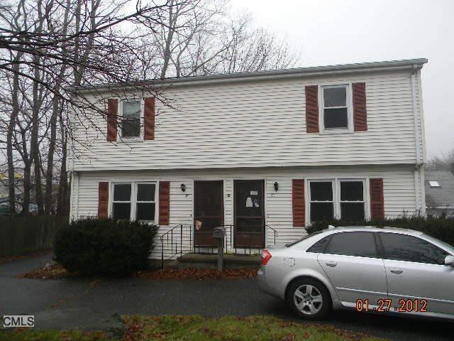 a view of a car parked in front of a house