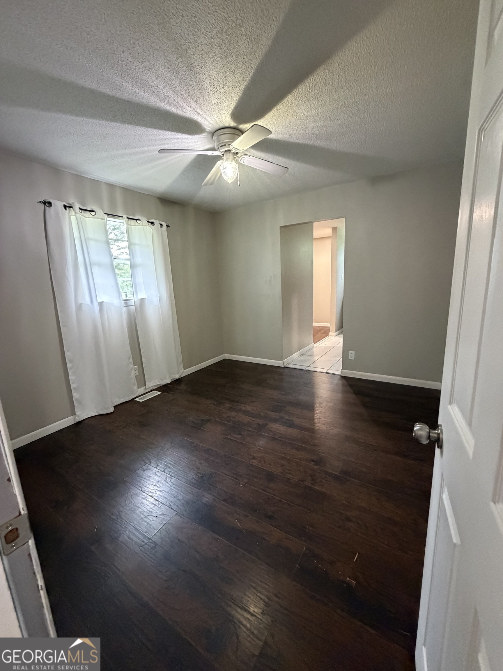 1144 Ridgeway Road LaFayette, GA 30728 - Photo 57 of 66 an empty room with wooden floor and windows